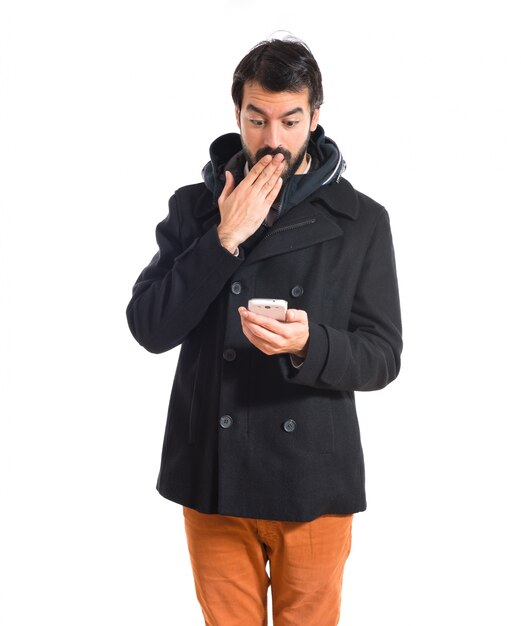 Surprised man talking to mobile