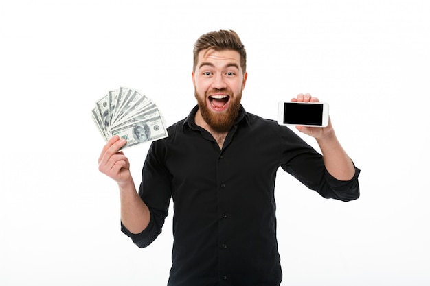 Surprised pleased bearded business man in shirt holding money