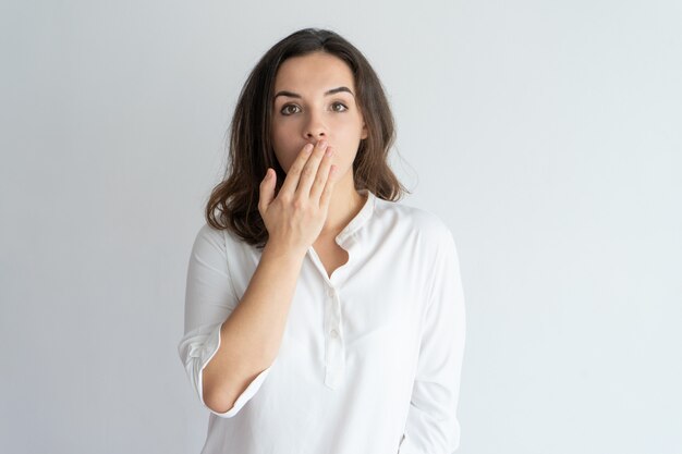 Surprised and shocked girl learning news or gossip. 