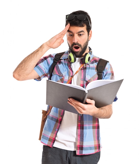 Surprised tourist reading book