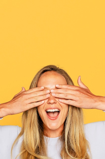 Surprised woman hands covering her eyes