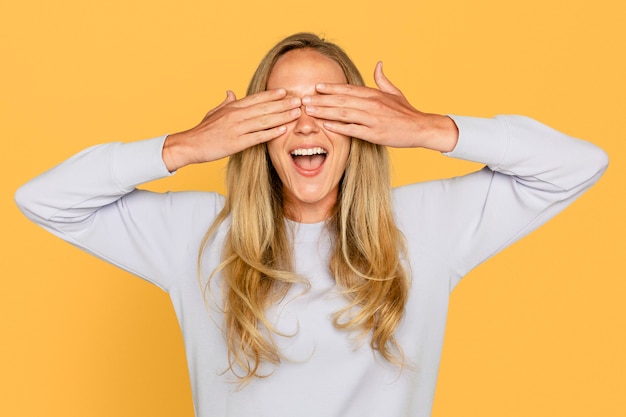 Free photo surprised woman hands covering her eyes