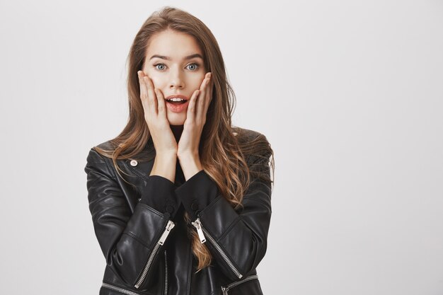 Surprised woman hear good news, look excited