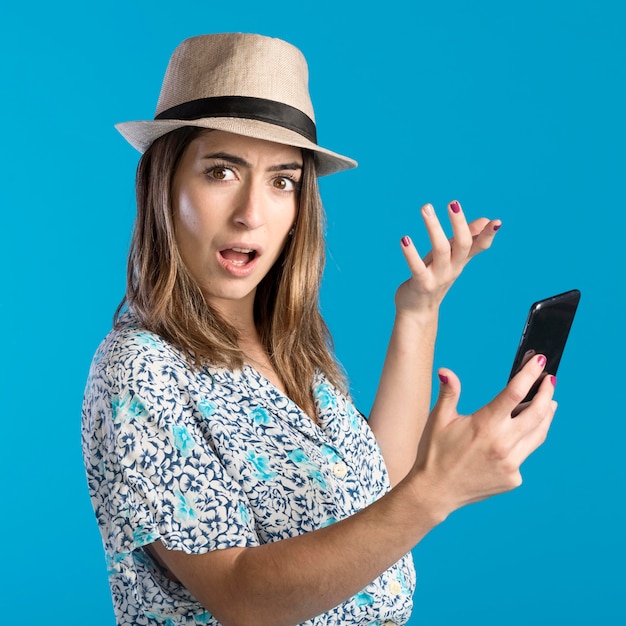 Surprised woman holding phone