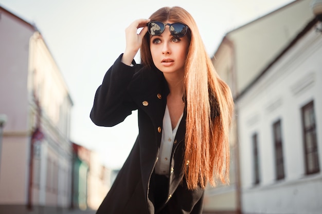 Surprised woman paying attention on the street