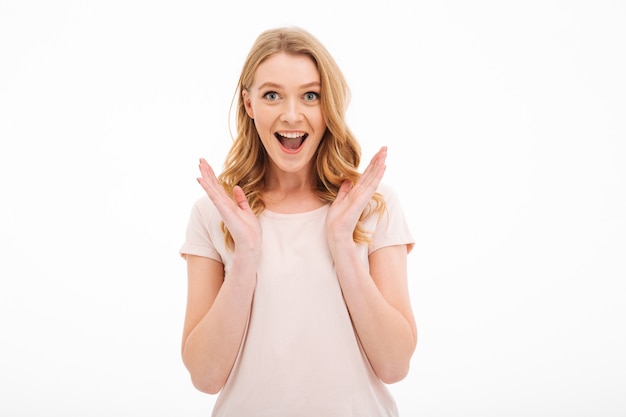 Surprised woman standing isolated