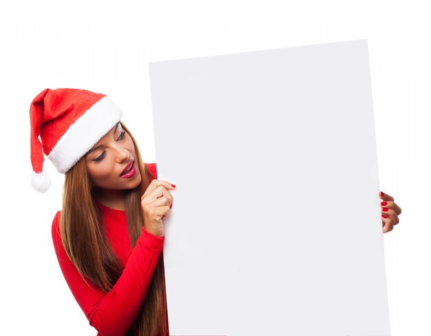 Surprised woman with a blank sign