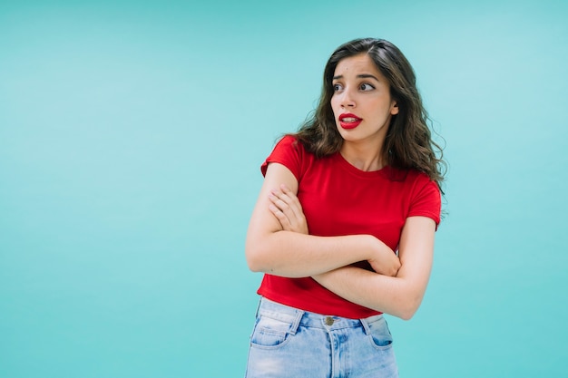 Surprised woman with crossed arms and funny face