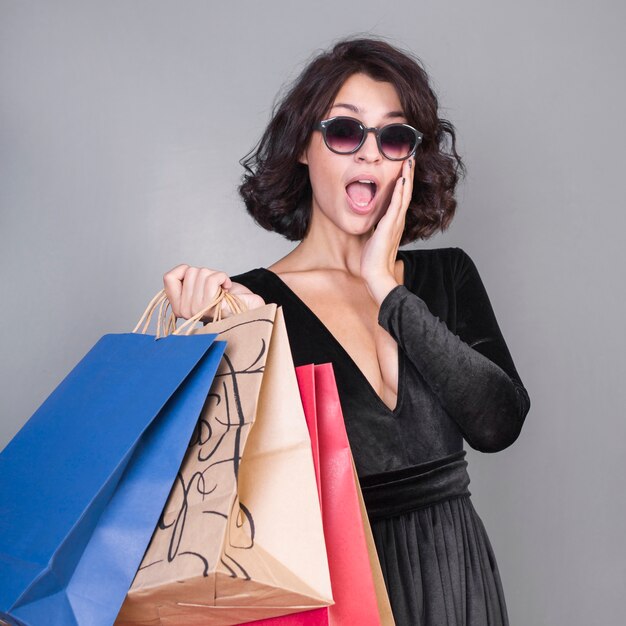 Surprised woman with shopping packets 