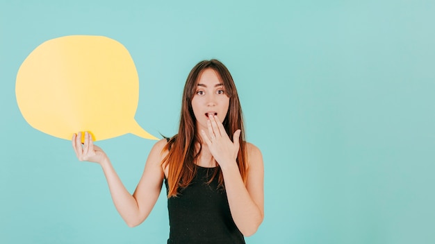 Free photo surprised woman with speech bubble