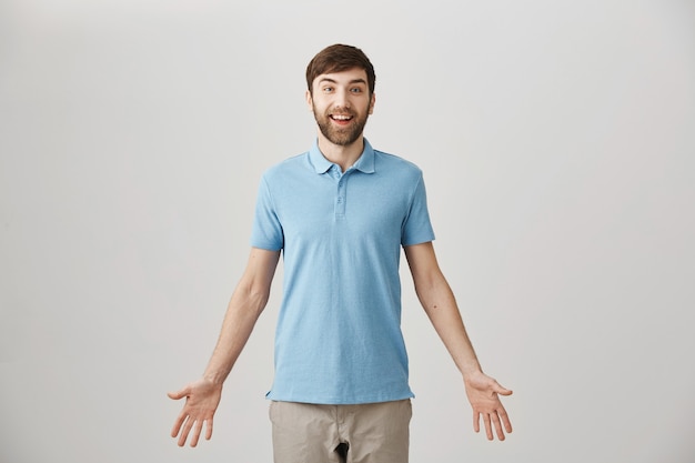 Surprised young bearded man posing