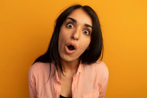 Surprised young beautiful woman wearing pink t-shirt