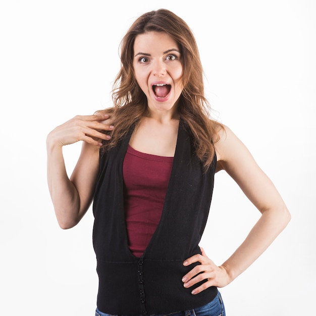 Surprised young woman on white background