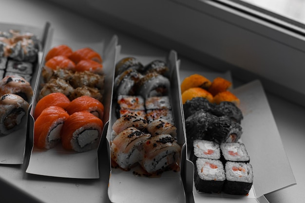 Sushi in different forms A variety of sushi rolls for delivery