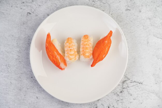 Sushi is beautifully arranged on the plate.