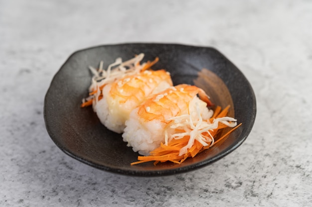 Sushi is beautifully arranged on the plate.