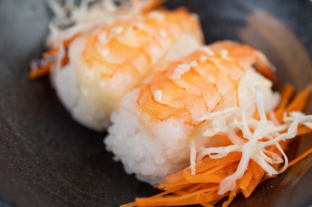 Free photo sushi is beautifully arranged on the plate.