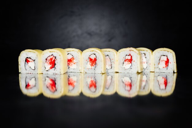 Sushi roll made of Nori, Marinated rice, Philadelphia, Cheese, Massa Caviar, Shrimp