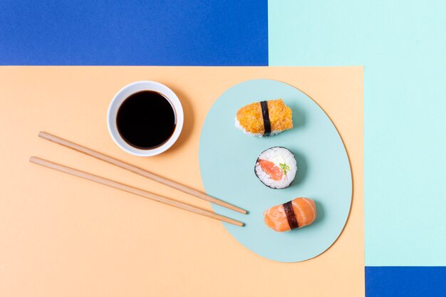 Sushi rolls on plate on table