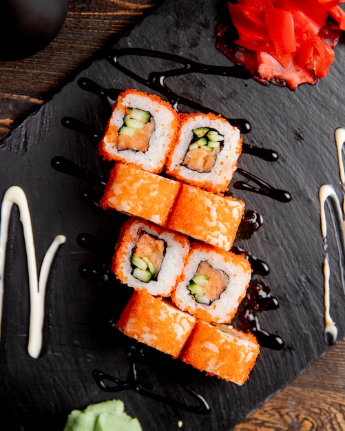 Sushi rolls with cucumber served with wasabi and ginger