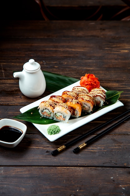 Free photo sushi rolls with soybean sauce