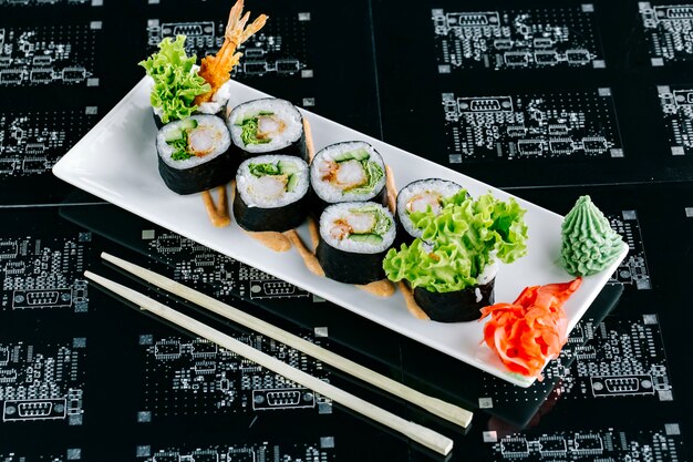 Sushi rolls with tempura cucumber and lettuce