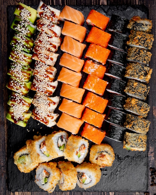 Free photo sushi set hot rolls avocado california and salmon rolls