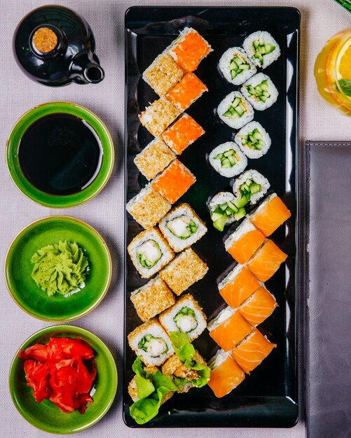 Sushi set philadelphia crab maki kappa maki ginger soya sauce wasabi top view