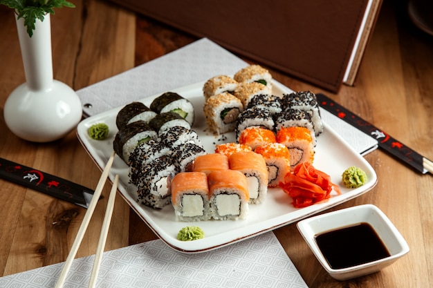 sushi set philadelphia roll with cream cheese and salmon california roll with crab meat and tobiko caviar kappa maki