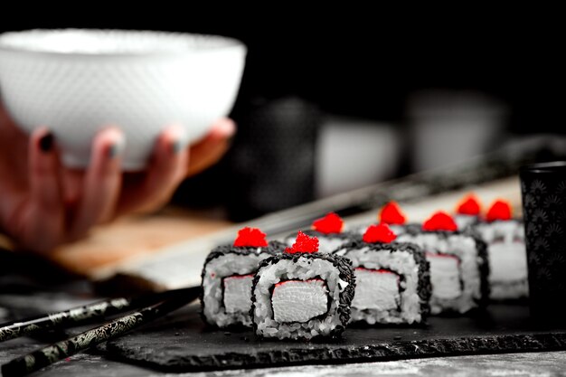 Sushi set with black cover and rice