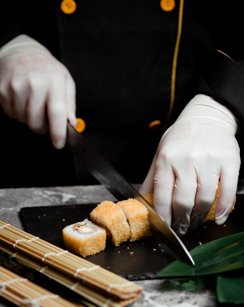 Sushi set with gold color on the table