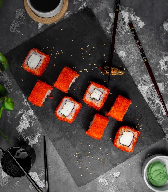 Sushi set with red caviar on the table top view
