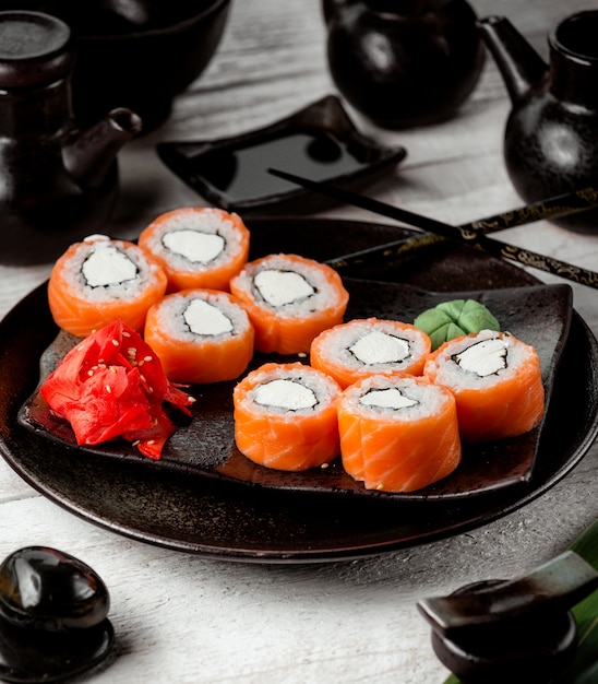 Free photo sushi set with salmon on the table