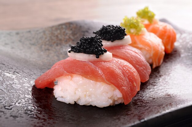 Sushi with rice, salmon and caviar