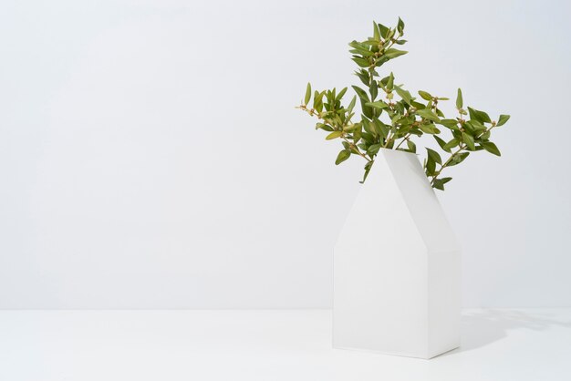 Sustainability concept with plants growing from geometric forms