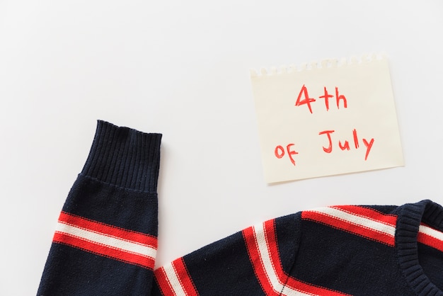 Free photo sweater and sheet of paper with lettering 4th of july