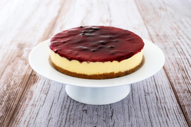 Sweet cheesecake on wooden table