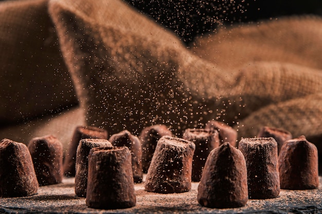 Sweet chocolate assortment on dark board close-up