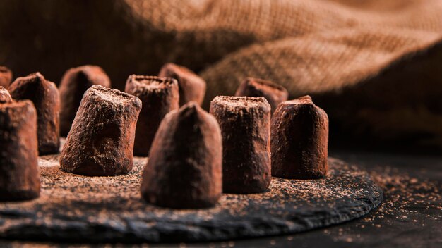 Sweet chocolate assortment on dark board