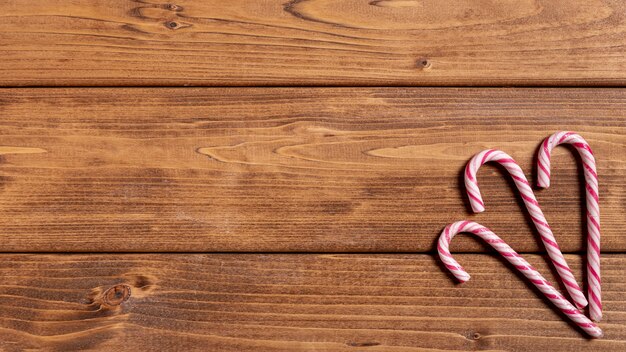 Sweet christmas canes on wooden table