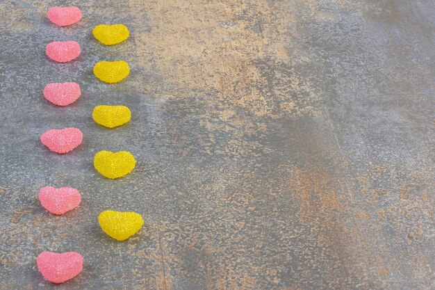 Free photo sweet colorful jelly candies on a dark background. high quality photo