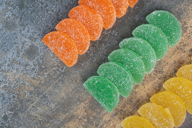 Sweet colorful jelly candy on marble background