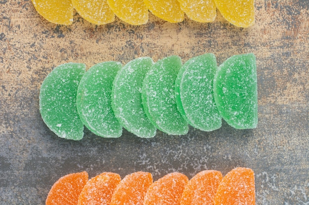 Sweet colorful jelly candy on marble background