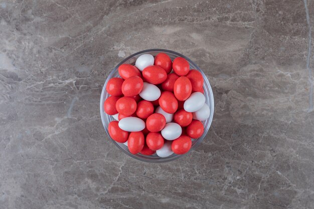 Sweet confectionery in the bowl  on the marble surface