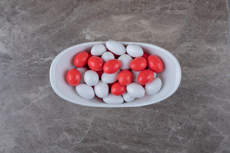 Free Photo sweet confectionery in the bowl  on the marble surface