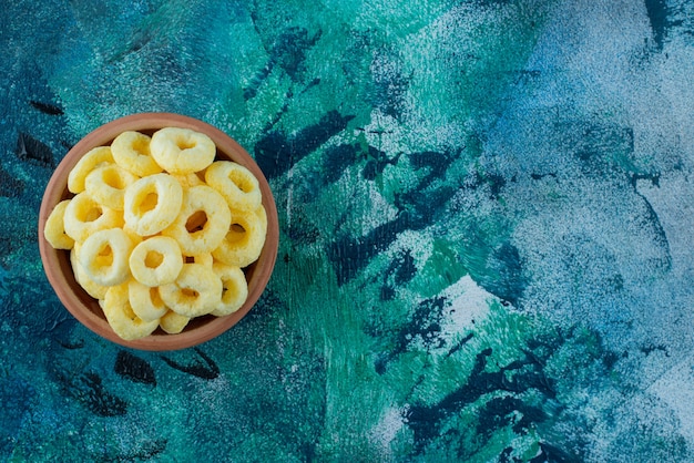 Sweet corn ring in a clay bowl , on the marble table.