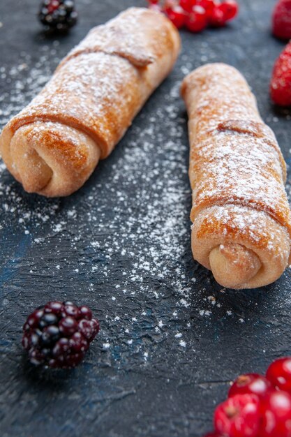 sweet delicious bangles with filling yummy baked with fruits and berries on dark