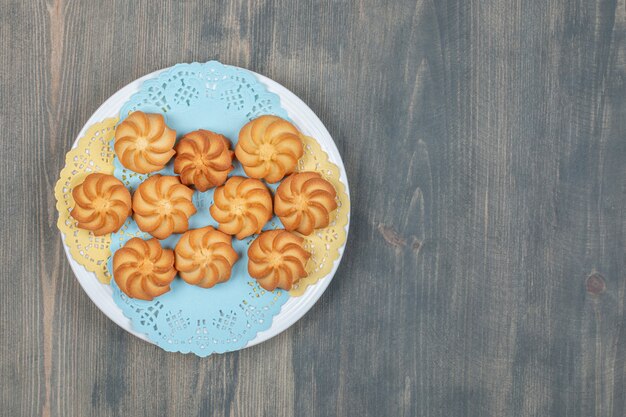 Sweet delicious browned shortbread cookies in a white plate