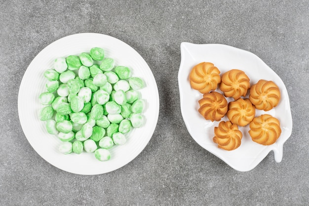 Sweet delicious browned shortbread cookies with green candies 