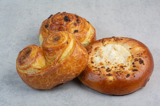 Sweet delicious pastries on dark board.